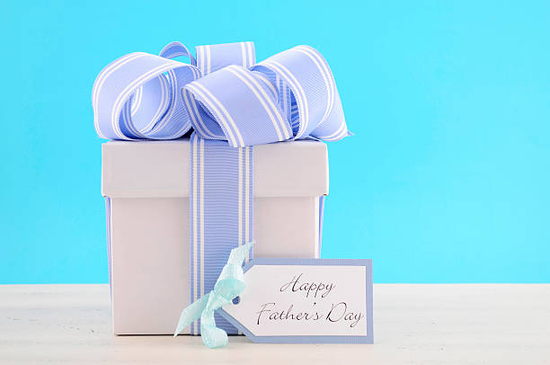 istock Happy Fathers Day Gift with Blue and White Ribbon 476580200