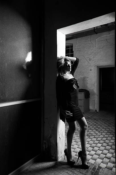 istock Woman with Door. Black and White 476580377