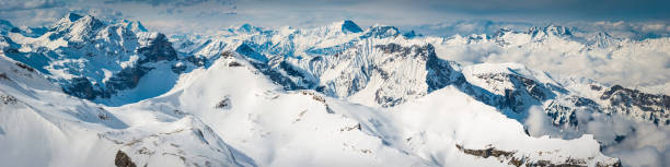 istock Epic Alpine mountain peaks pinnacles panorama snowy winter summits glaciers 476580451