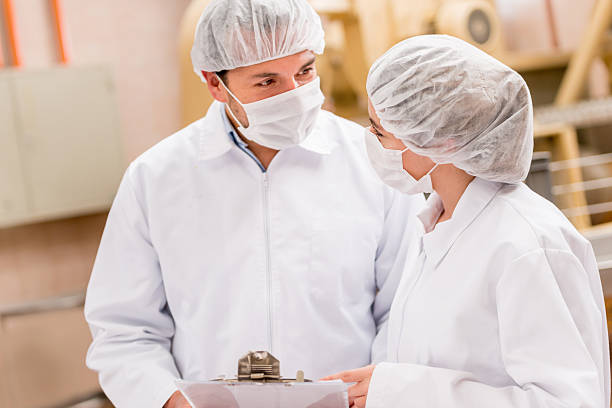 istock People working at a food factory 476581356