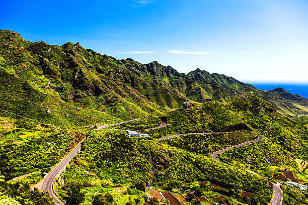 istock Green mountains or rocks valley with road 476582790