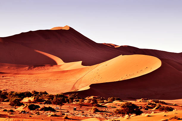 istock Sunlight over Sossusvlei in Namib desert 476585569