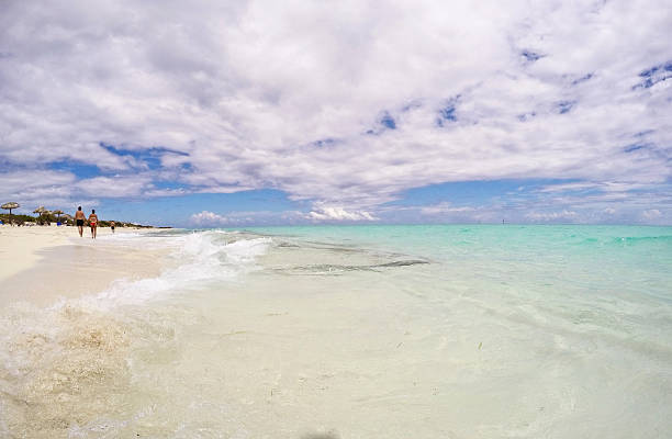 istock Beach With Tourists and Waves 476587938