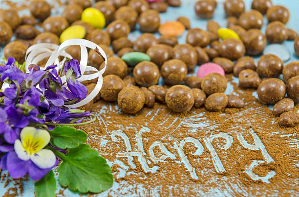 Chocolate balls on a table with the word Happy