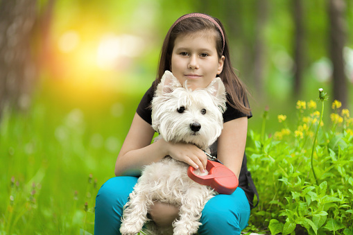 woman with west highland white terrier