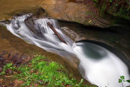 Swirling waters in the Upper Gorge at Old Man's Cave in Ohio's Hocking Hills have eroded a pothole in the stone streambed called 