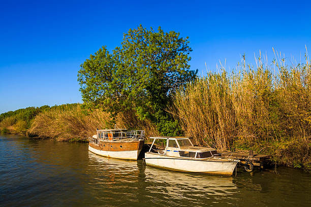 istock Two boats floating on the river 476590386