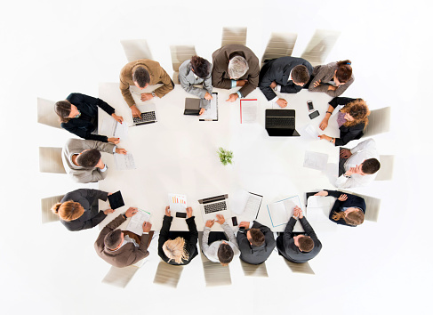 Above view of group of multi-tasking business people.