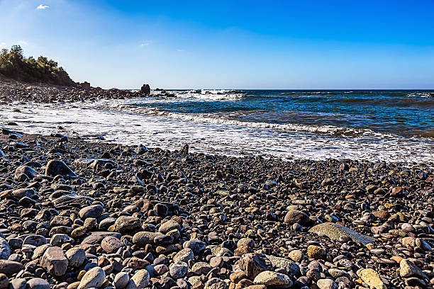 istock Wild stone beach on coast of ocean 476593192