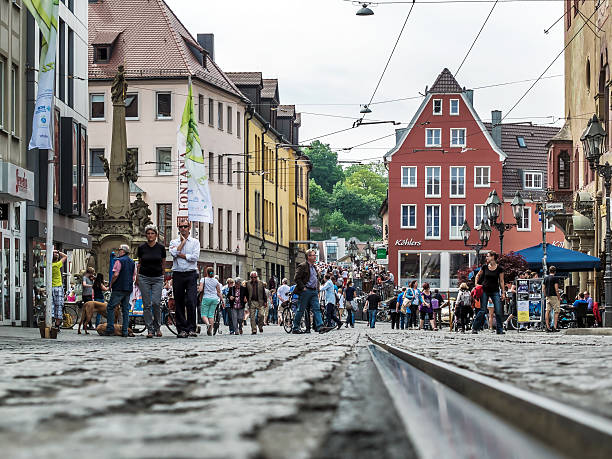 Würzburg Würzburg, Germany - May 14, 2015: Pedestrians walk in the Domstraße in Würzburg. left is the four tubes fountain and on the right the old town hall. press room photos stock pictures, royalty-free photos & images