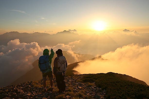 istock Couple at sunset in mountains 476593623
