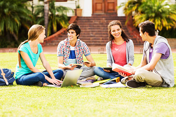 istock Group Of Students Studying Together In Quad On College Campus 476593861