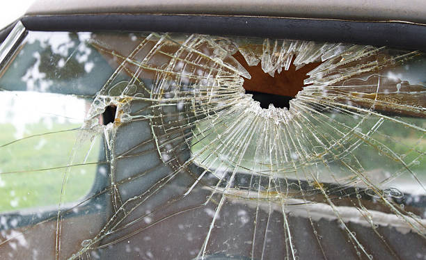 istock Shattered Glass: Truck Windshield with Two Holes 476594374
