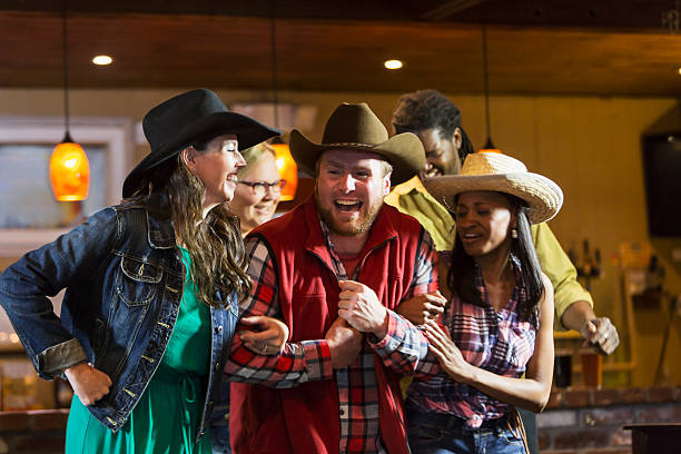 istock Multi-ethnic group of friends dancing in a bar 476595926