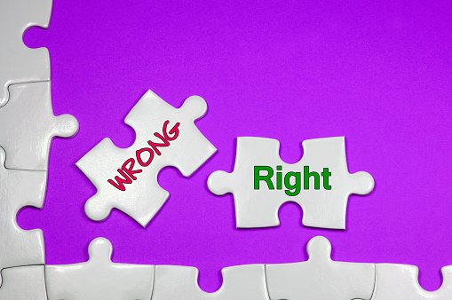 Wrong and Right word on white puzzle - Business Concept