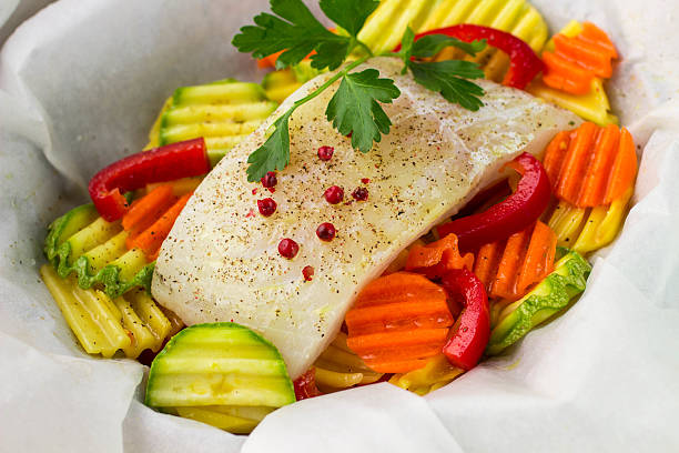 istock Cooking fish with vegetables in parchment. Healthy eating, diet 476600568