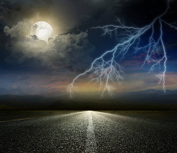 istock moon and lightning above the road 476601717