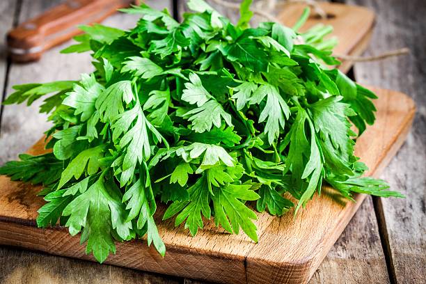 istock organic fresh bunch of parsley closeup 476602578