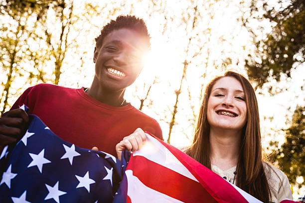 istock Teenagers with USA flag 476603926