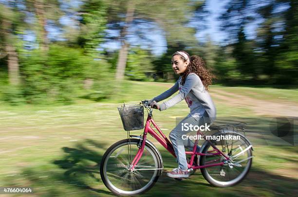 Girl Cycling On The Forest Way Stock Photo - Download Image Now - Cycling, Bicycle, Side View
