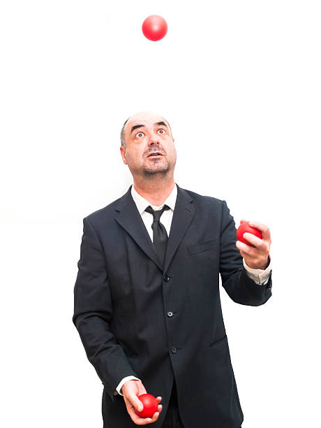 istock Businessman that is juggling with a red balls 476604924