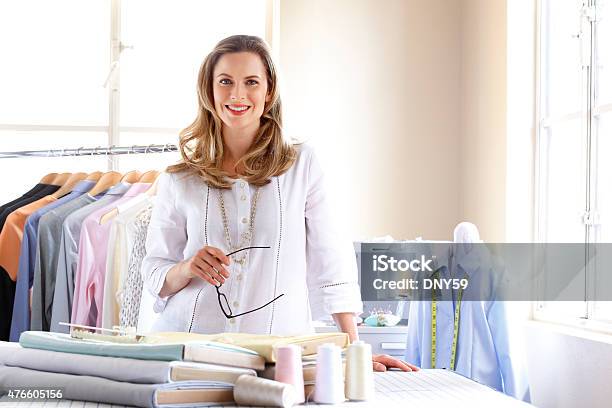 Portrait Of A Female Dressmaker Working In Her Studio Stock Photo - Download Image Now