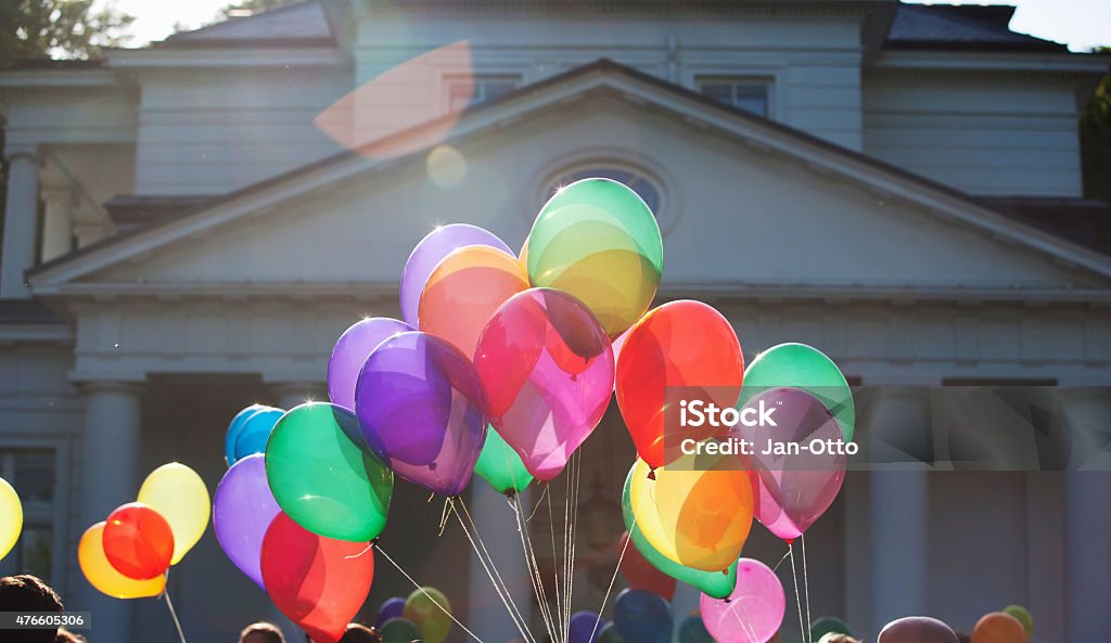 Colourful balloons of wedding celebration in front of luxury villa Colourful balloons of a wedding celebration in front of a luxury villa. Balloon Stock Photo