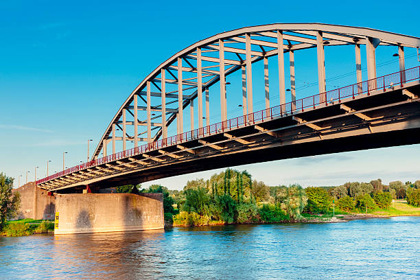 Arnhem Bridge, Netherlands Arnhem Bridge spanning the River Rhine in the Netherlands soon after dawn. Scene of a famous battle during World War Two in September 1944, it's also known as the John Frost Bridge after the commander of the British troops who held out on the north end. arnhem photos stock pictures, royalty-free photos & images
