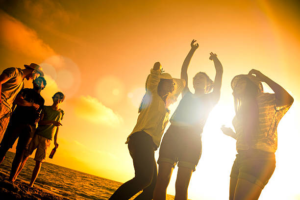 istock Friends in vacation dancing on the beach 476608142
