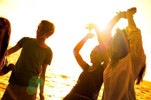 istock Friends in vacation dancing on the beach 476608186