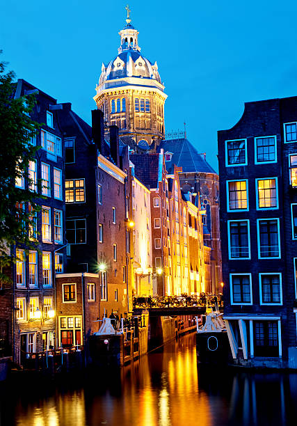 istock Canal and St. Nicolas Church in Amsterdam 476609581