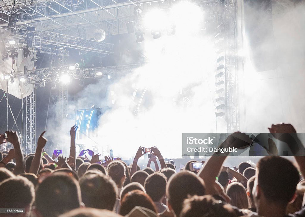 Concert crowd Concert Crowd in front of stage-lights Adults Only Stock Photo