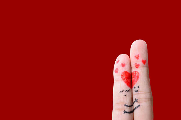 istock happy couple in love with painted smiley and hugging 476610109