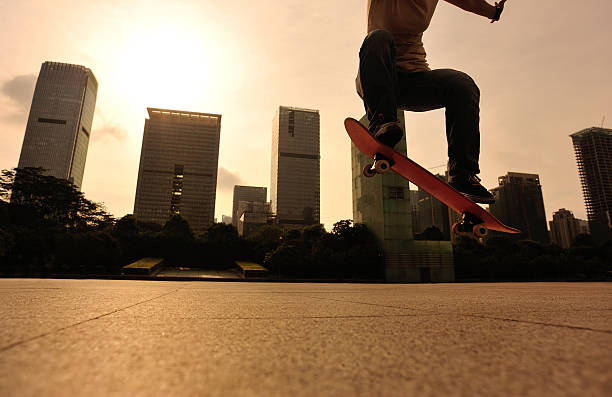 istock skateboarder doing skateboarding trick ollie on city 476612986
