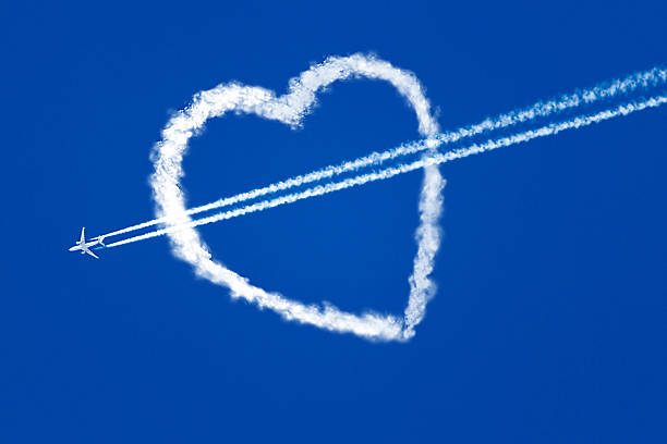 istock aircraft at the blue sky flying through the heart 476613208