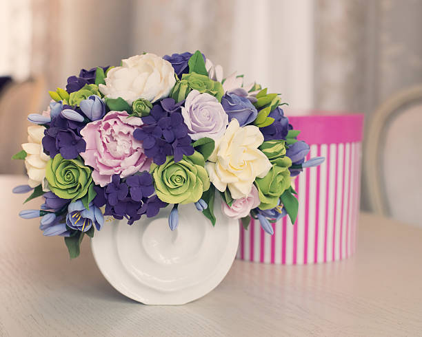 istock Rose flower bouquet and gift box on wooden table 476614234