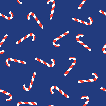 Vector illustration of candy canes in a repeating pattern on a blue background.
