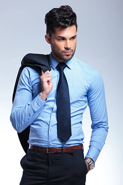 istock business man holds jacket on shoulder 476619761