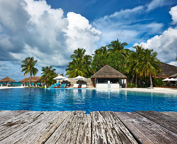 istock Swimming pool and old wooden pier 476621242