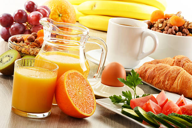 istock Breakfast including coffee, bread, orange juice, muesli and fruits 476623183