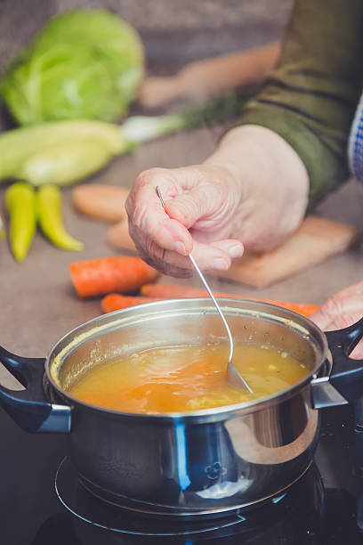 istock Grandmother steering soup 476625532