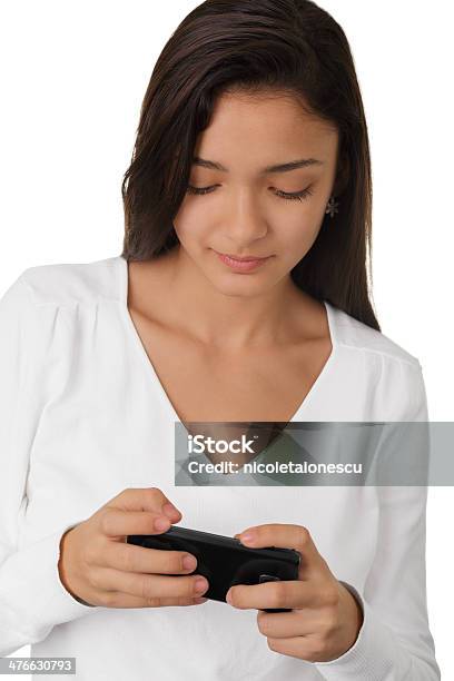 Girl Looking At Smartphone Foto de stock y más banco de imágenes de Adolescencia - Adolescencia, Adolescente, Adulto