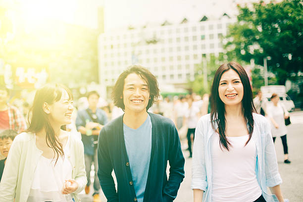 istock Young people  walking against cityscape 476631558