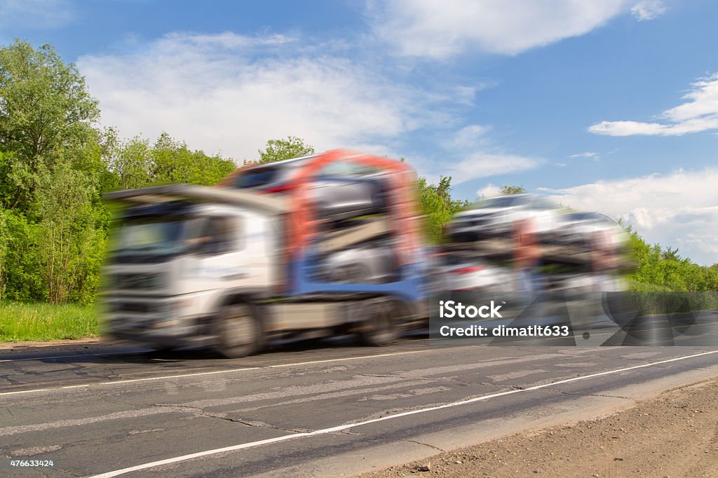 Car carrier delivering cars. Car carrier delivering cars.  2015 Stock Photo