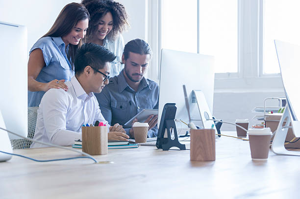 istock Multi ethnic group of business people working. 476638386