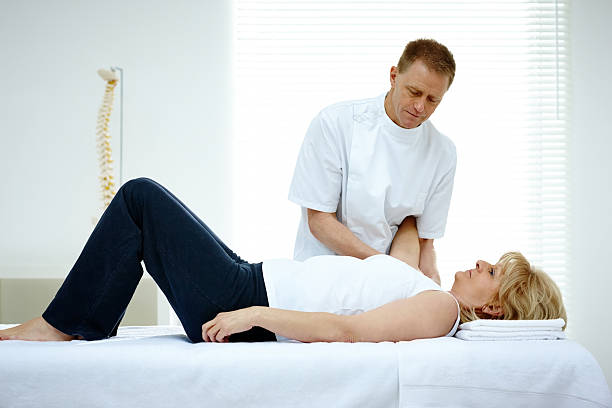 istock Health practitioner giving woman a osteopathy treatment 476638470