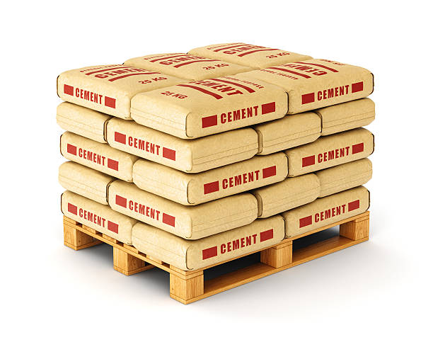 Cement bags on pallet Cement bags stack on wooden pallet. Paper sacks isolated on white background. cement bag stock pictures, royalty-free photos & images