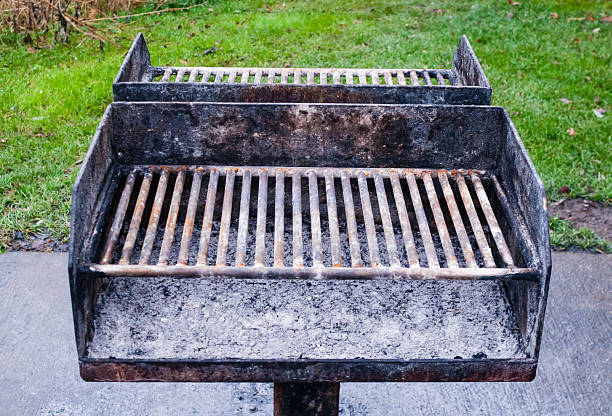 istock Dirty metal barbecue grill with ashes 476650048