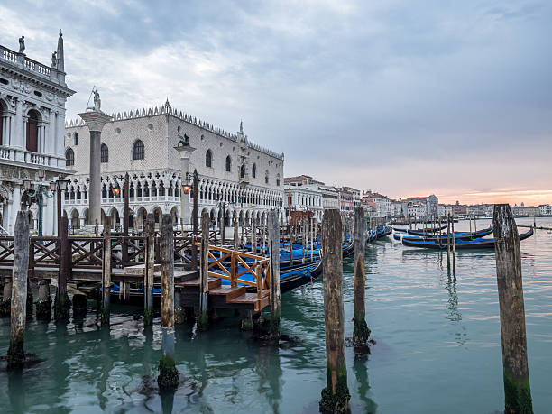 istock Venice, Italy -  Gondolas moored on the lagoon. Earl 476650234
