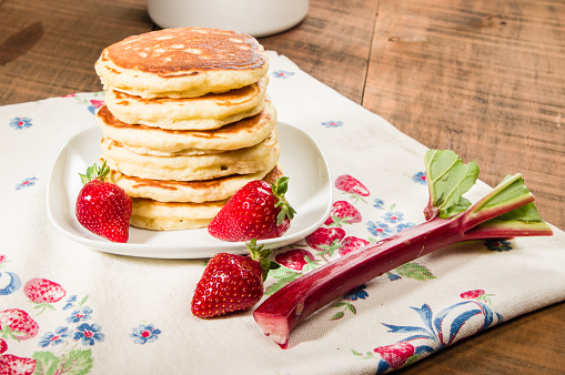 Stack of pancakes with strawberries and rhubarb